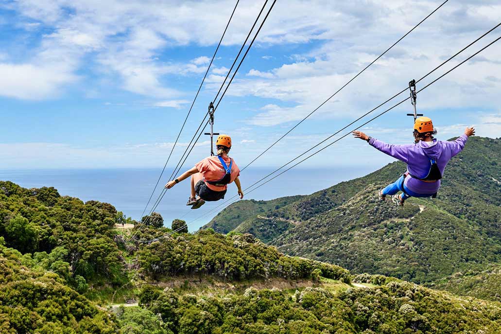 Tourists ziplining - Inca Jungle